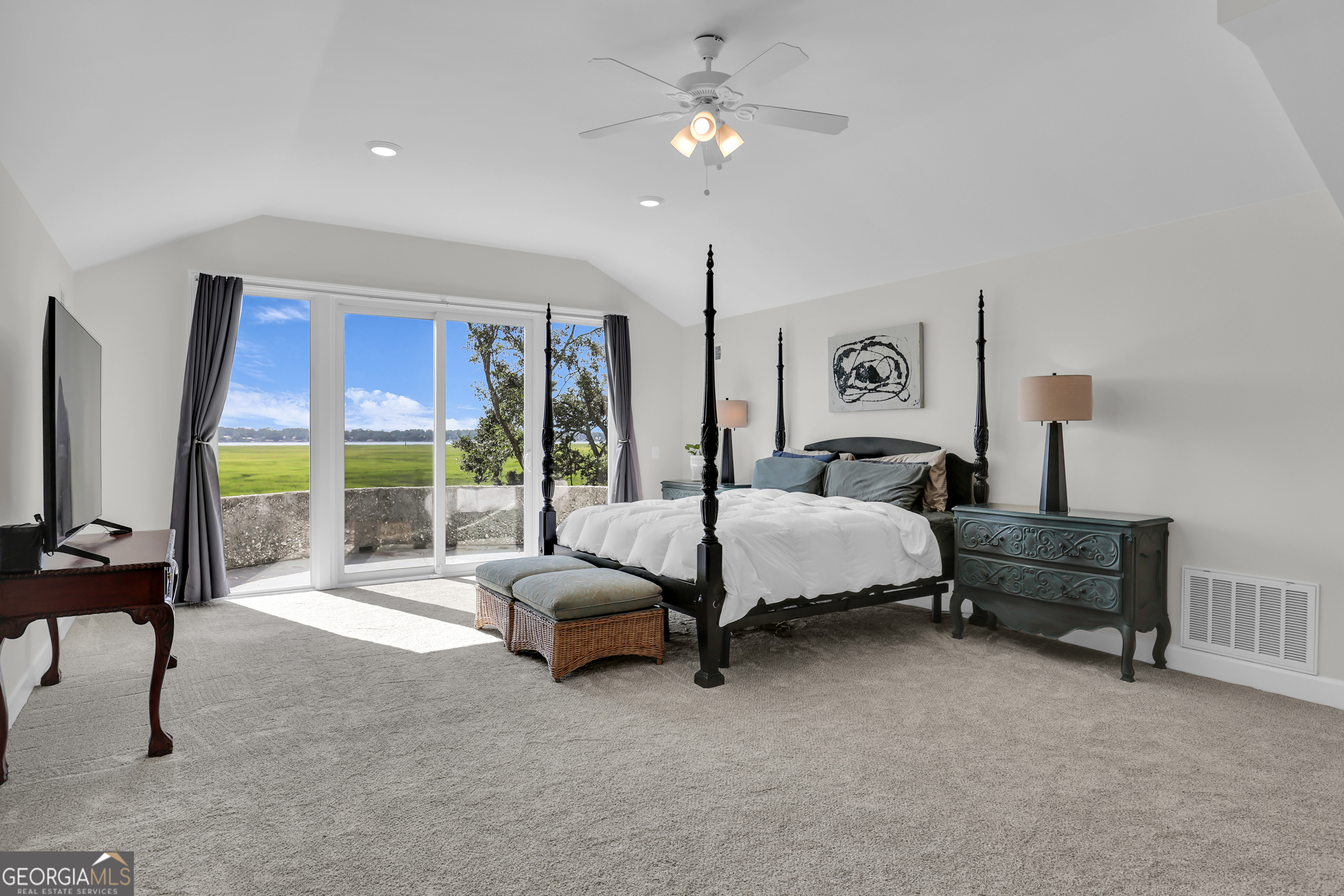 18 Modena Island Drive Savannah, GA 31411 - Photo 28 of 48 a spacious bedroom with a bed couch and a large window