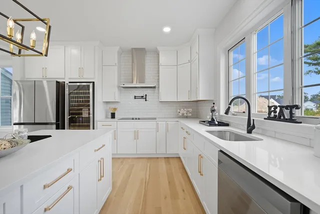 a kitchen with a sink stove and cabinets