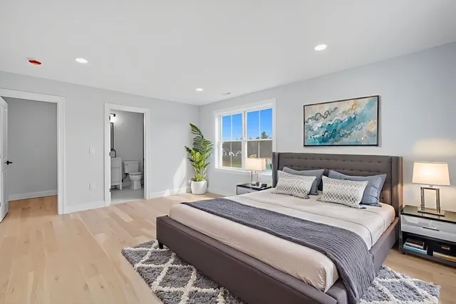 a bedroom with bed and window