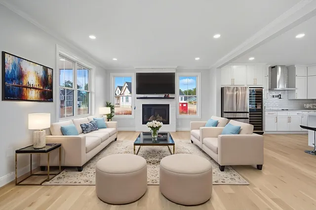 a living room with fireplace furniture and a flat screen tv