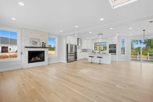 a view of a kitchen with a stove cabinets and a kitchen counter top