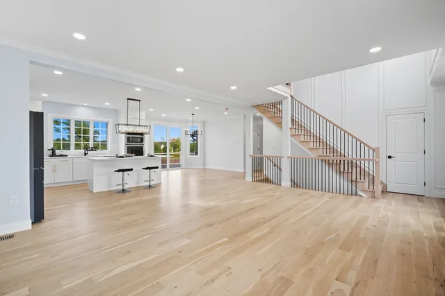 a view of kitchen with furniture and wooden floor
