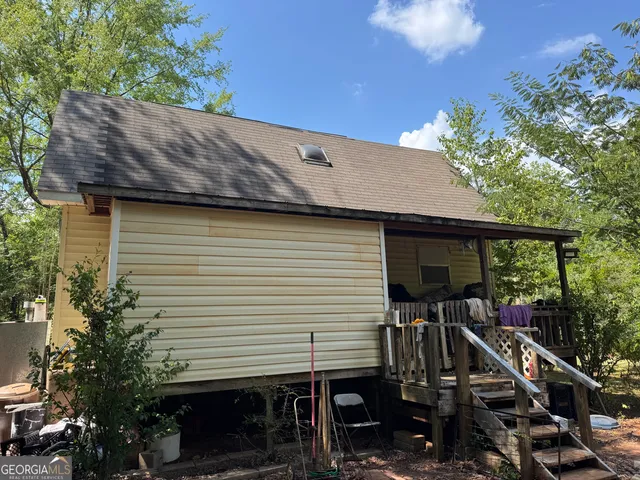 a house view with a backyard space