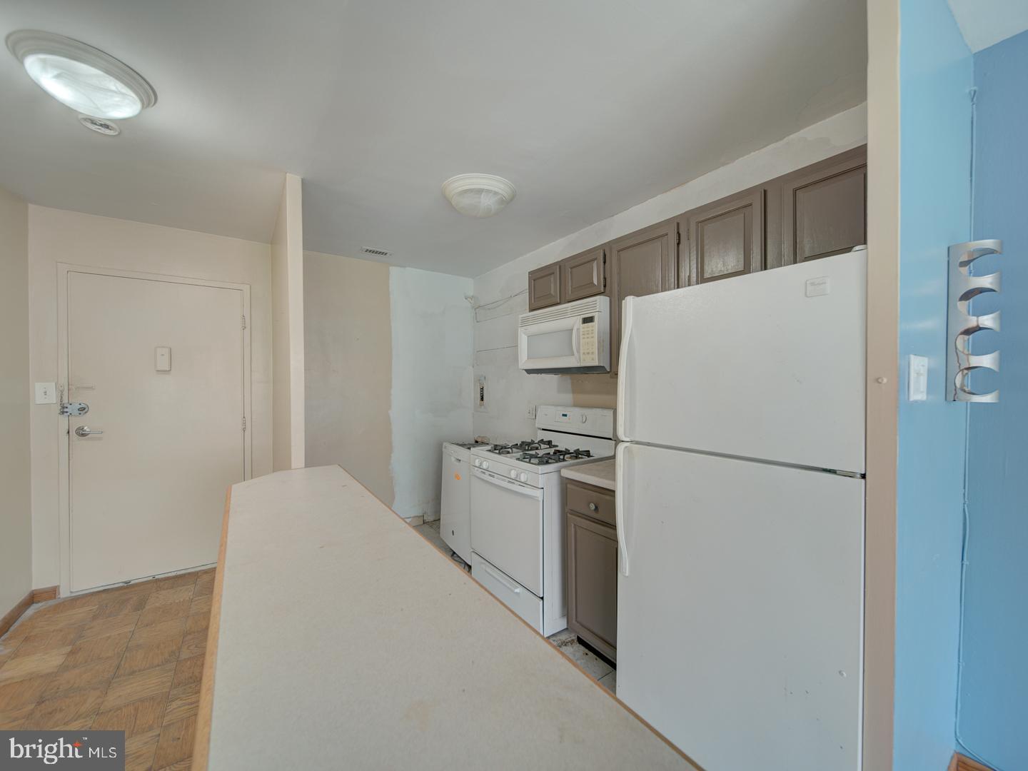 2829 Connecticut Avenue Northwest, Unit 606 Washington, DC 20008 - Photo 7 of 28 a white refrigerator freezer and a stove sitting inside of a kitchen