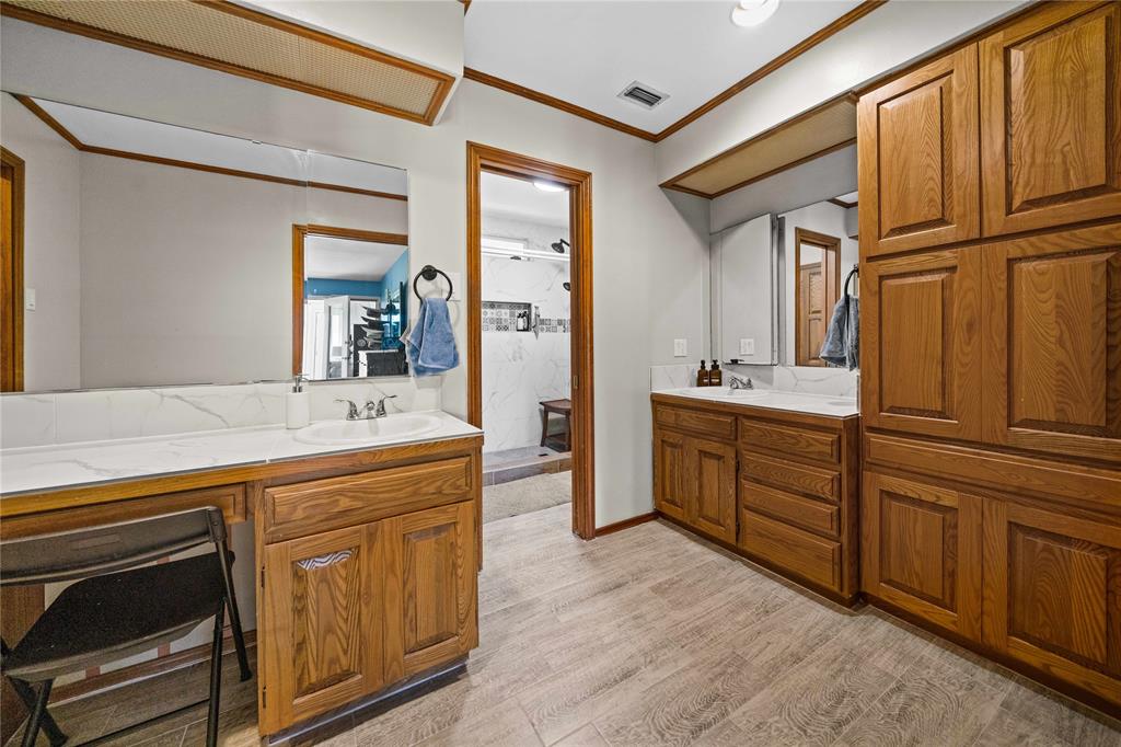 126 County Road, Unit 4212 Jacksonville, TX 75766 - Photo 11 of 39 a spacious bathroom with a double vanity sink a mirror and a