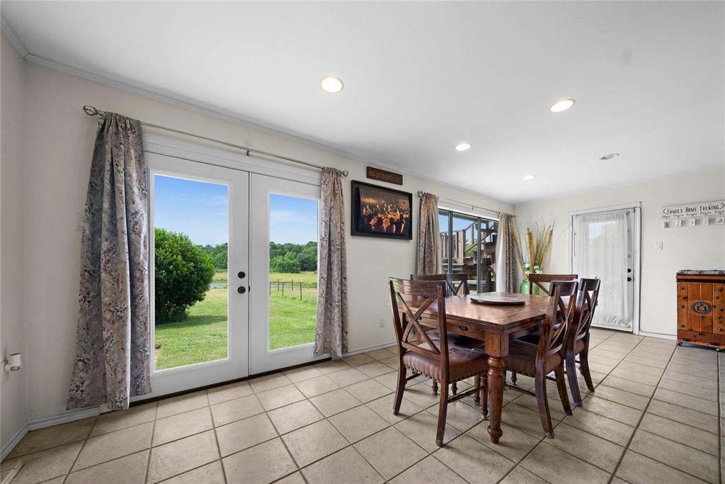 126 County Road, Unit 4212 Jacksonville, TX 75766 - Photo 18 of 39 a view of a dining room with furniture window and outside view