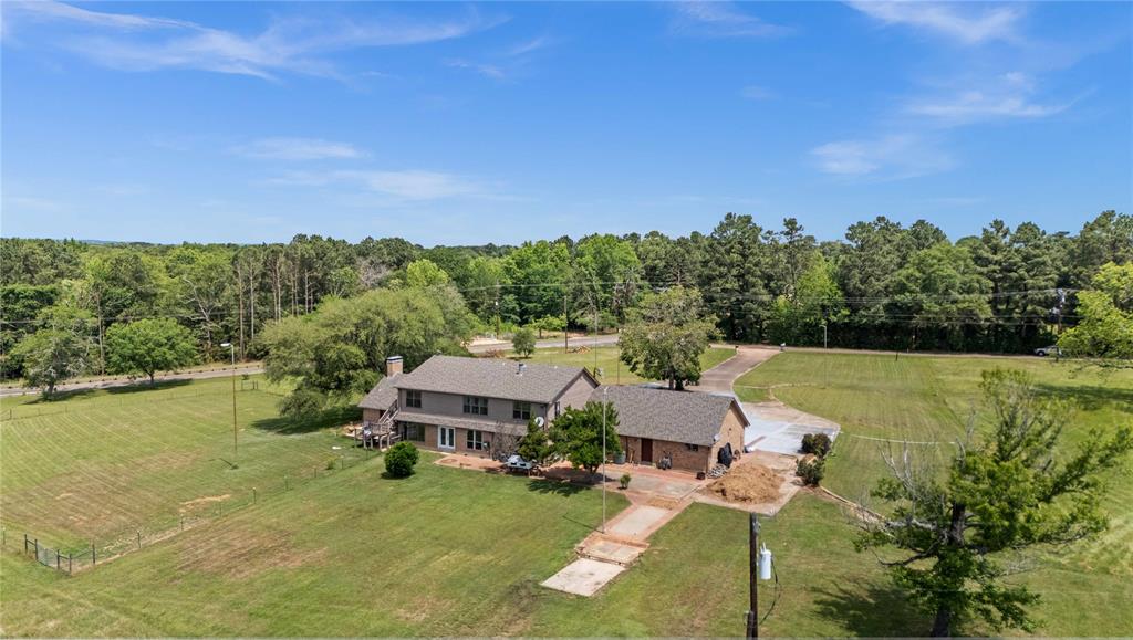 126 County Road, Unit 4212 Jacksonville, TX 75766 - Photo 31 of 39 a aerial view of a house with pool garden view and lake view