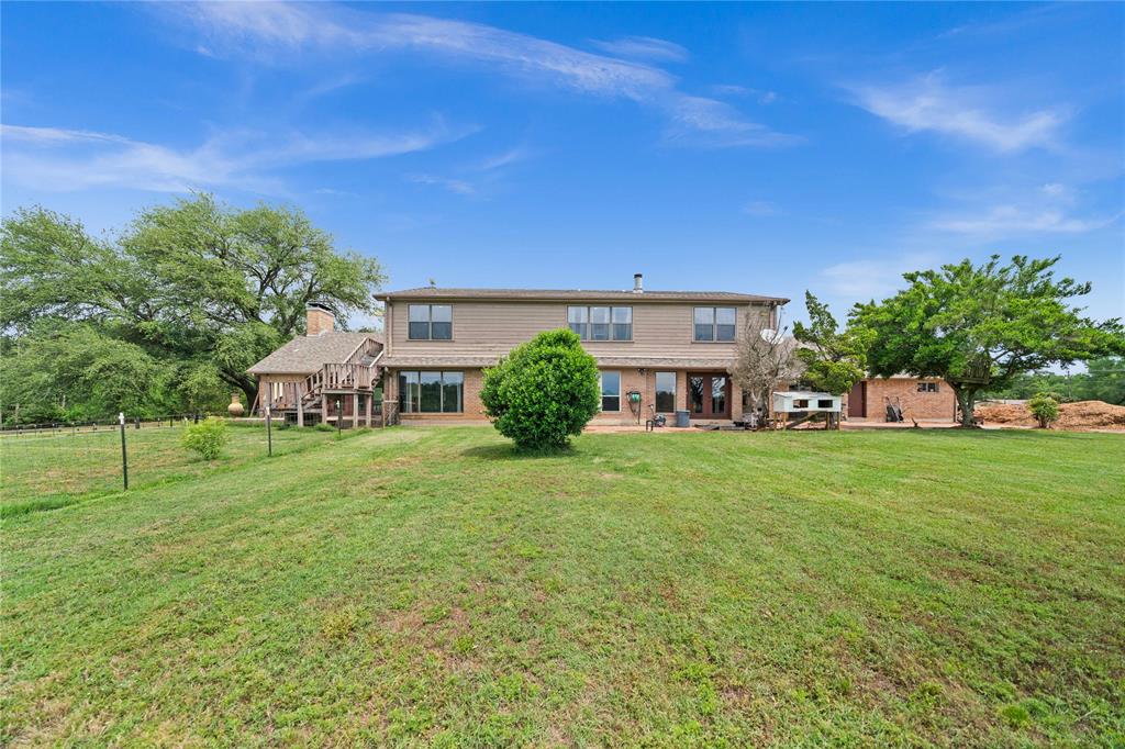126 County Road, Unit 4212 Jacksonville, TX 75766 - Photo 33 of 39 a house view with a garden space