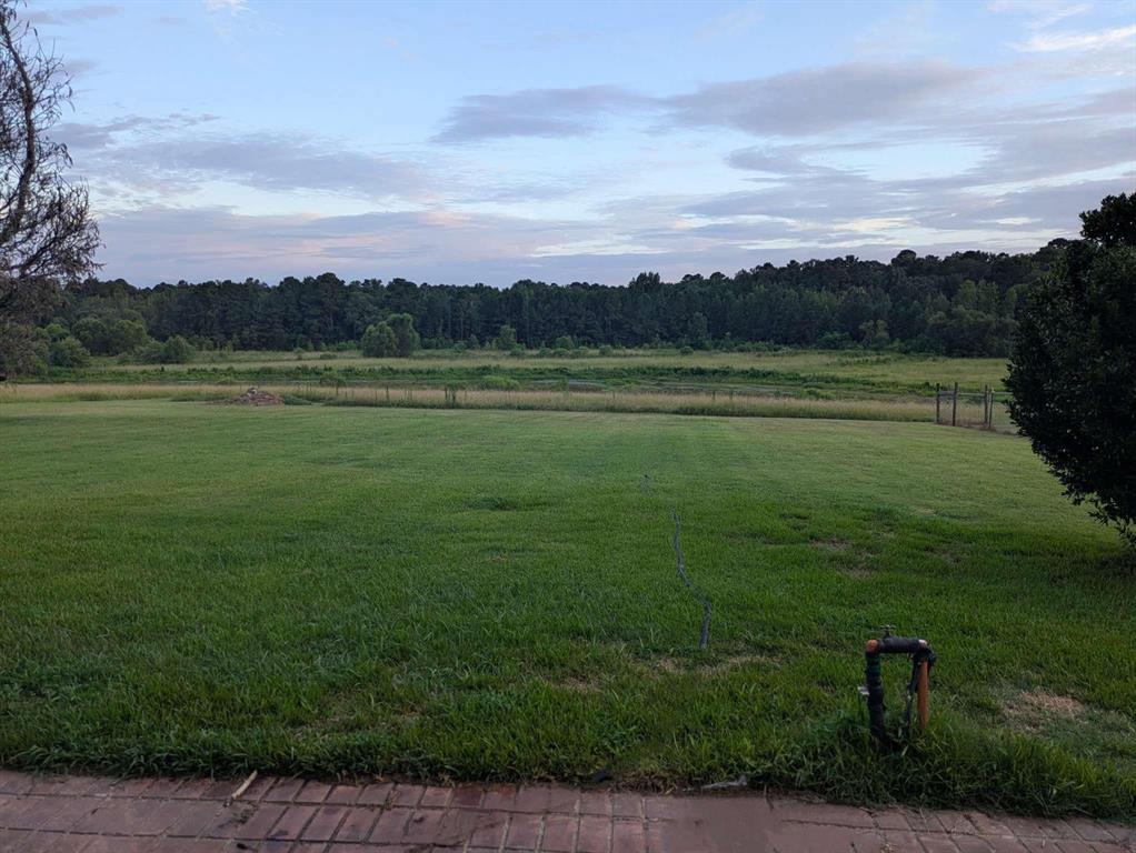 126 County Road, Unit 4212 Jacksonville, TX 75766 - Photo 35 of 39 a view of a lake with a yard