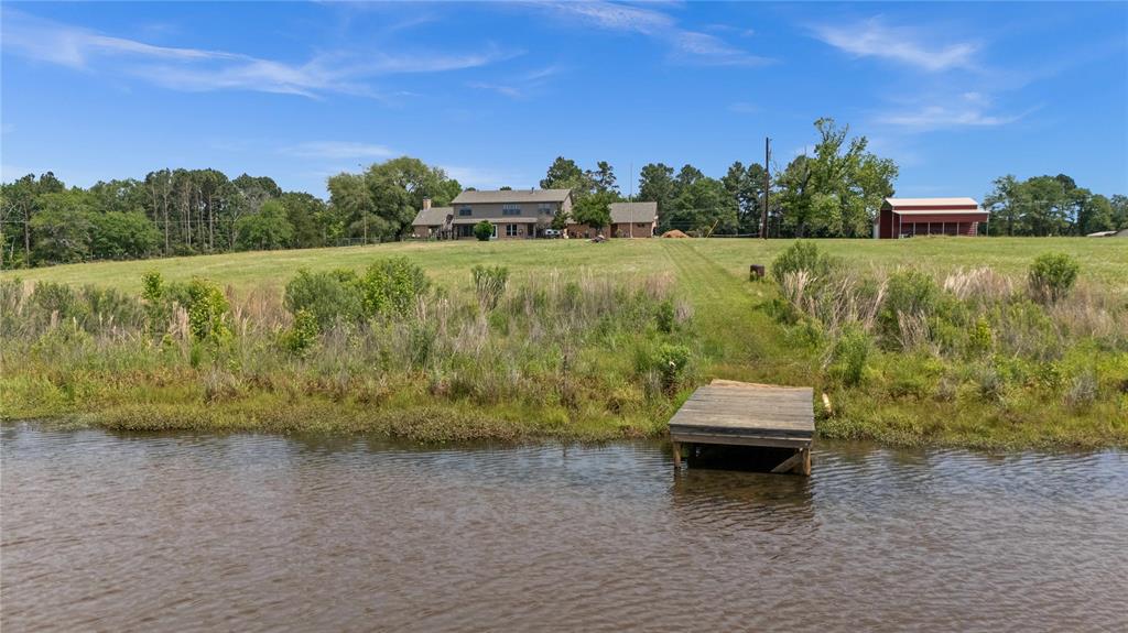 126 County Road, Unit 4212 Jacksonville, TX 75766 - Photo 38 of 39 a view of a lake with a mountain in the background