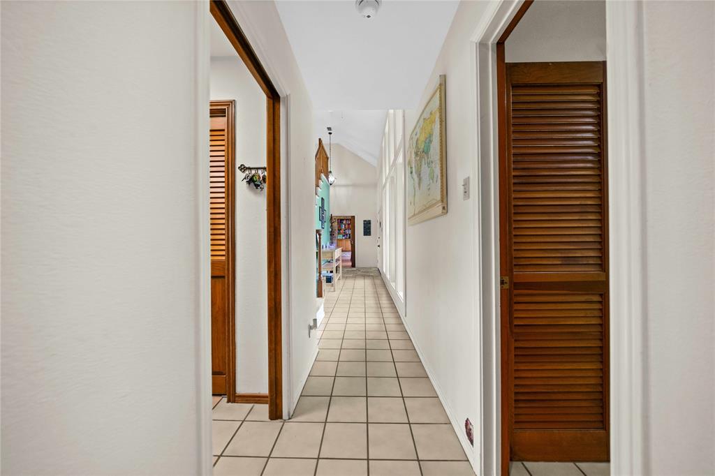 126 County Road, Unit 4212 Jacksonville, TX 75766 - Photo 9 of 39 a view of a hallway with wooden floor and staircase