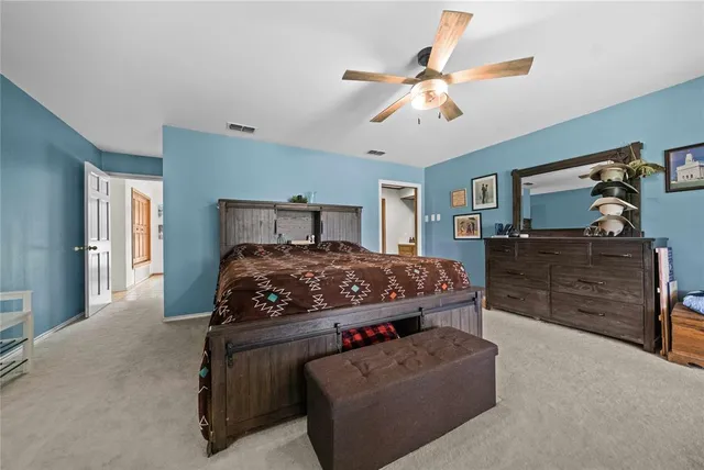 a spacious bathroom with a double vanity sink a mirror and a