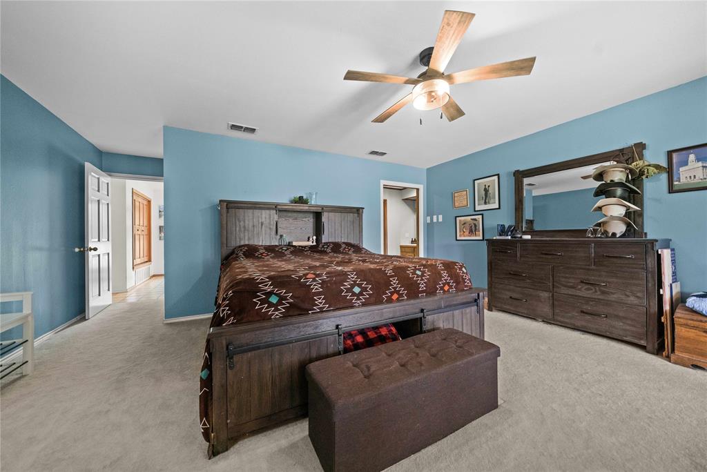 126 County Road, Unit 4212 Jacksonville, TX 75766 - Photo 10 of 39 a bedroom with a bed and furniture