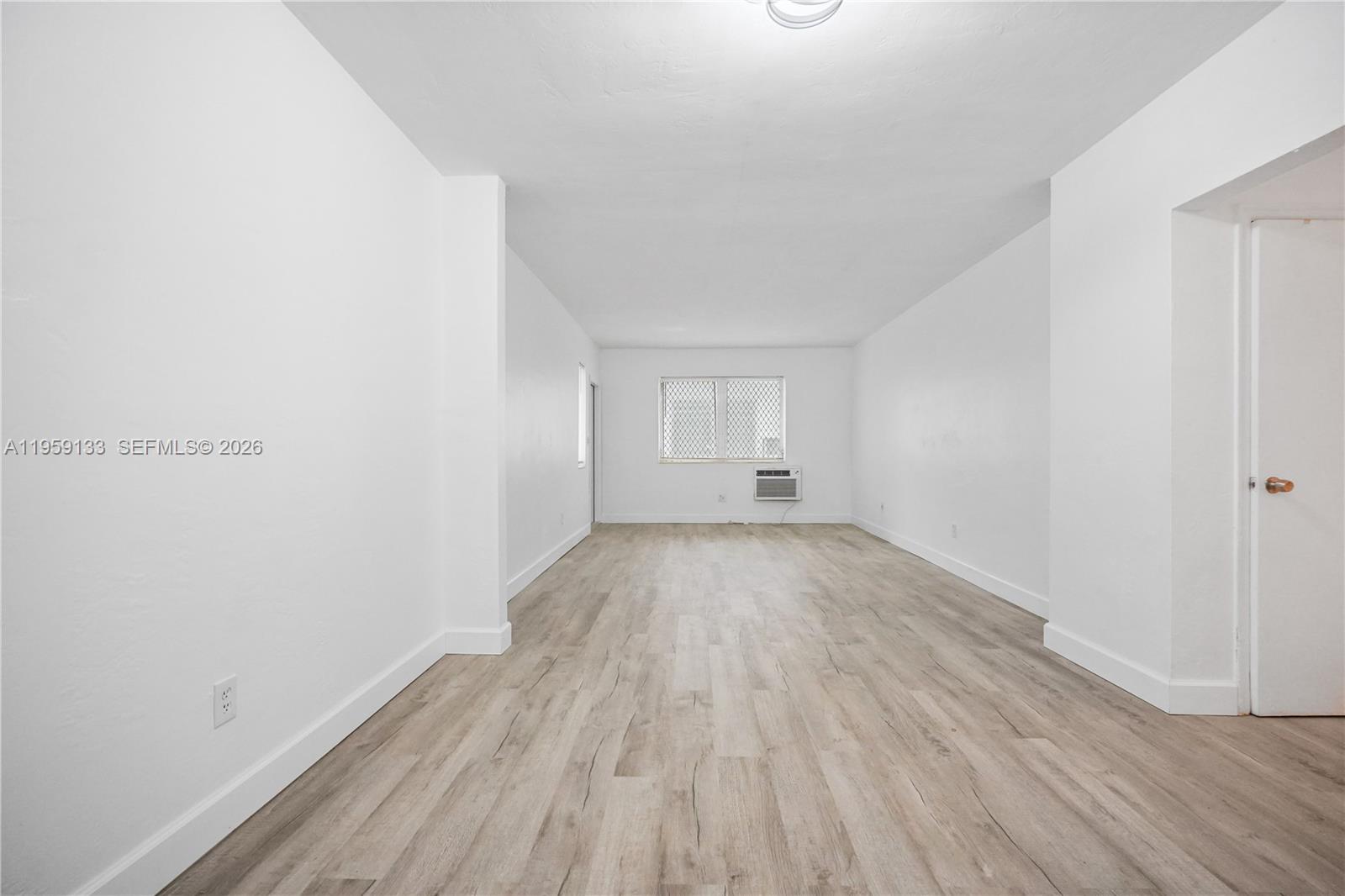 710 82nd Street, Unit 4 Miami Beach, FL 33141 - Photo 15 of 33 a view of empty room with wooden floor