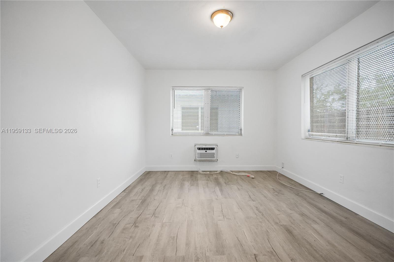 710 82nd Street, Unit 4 Miami Beach, FL 33141 - Photo 17 of 33 an empty room with a window