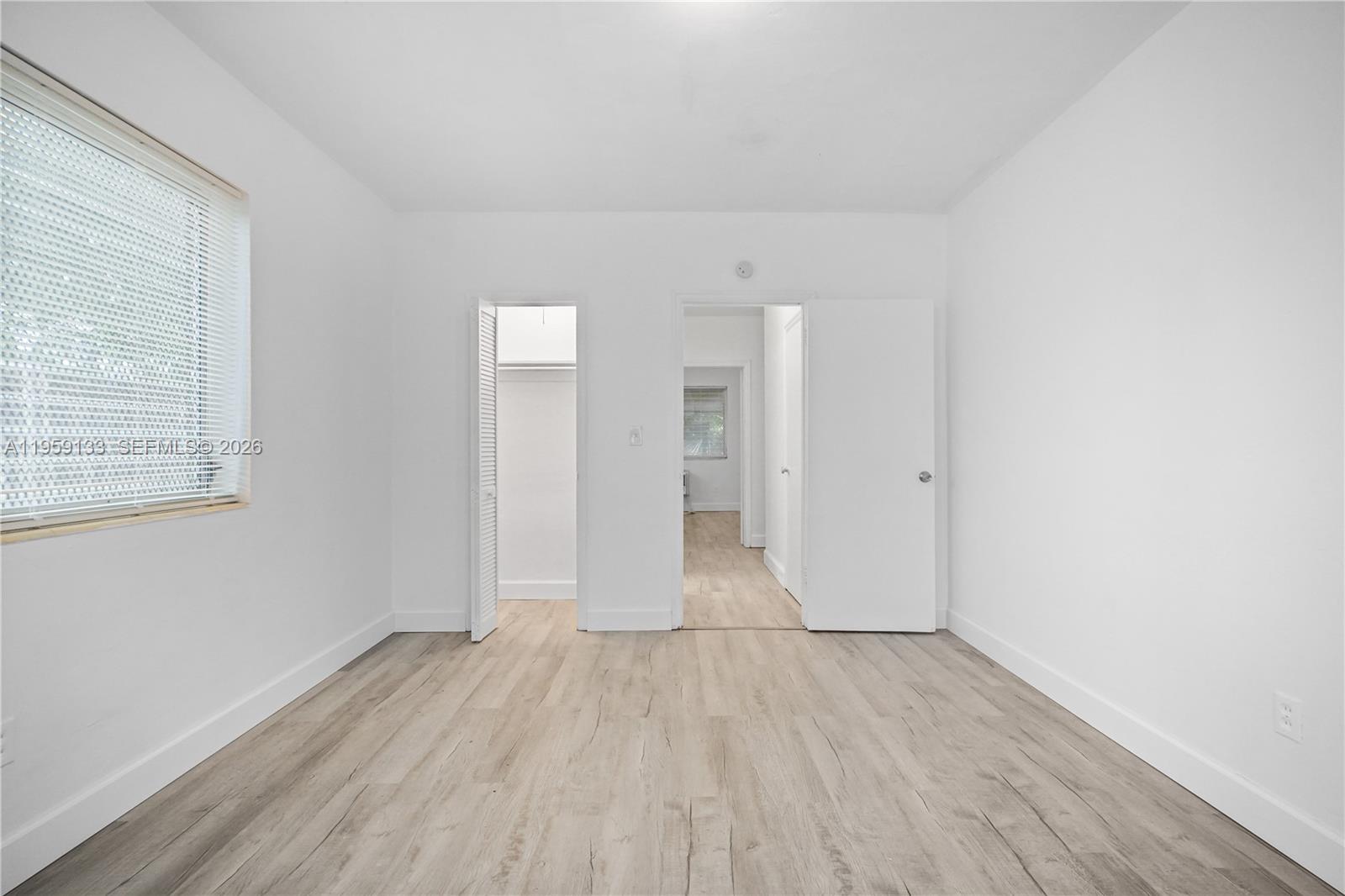 710 82nd Street, Unit 4 Miami Beach, FL 33141 - Photo 22 of 33 wooden floor in an empty room