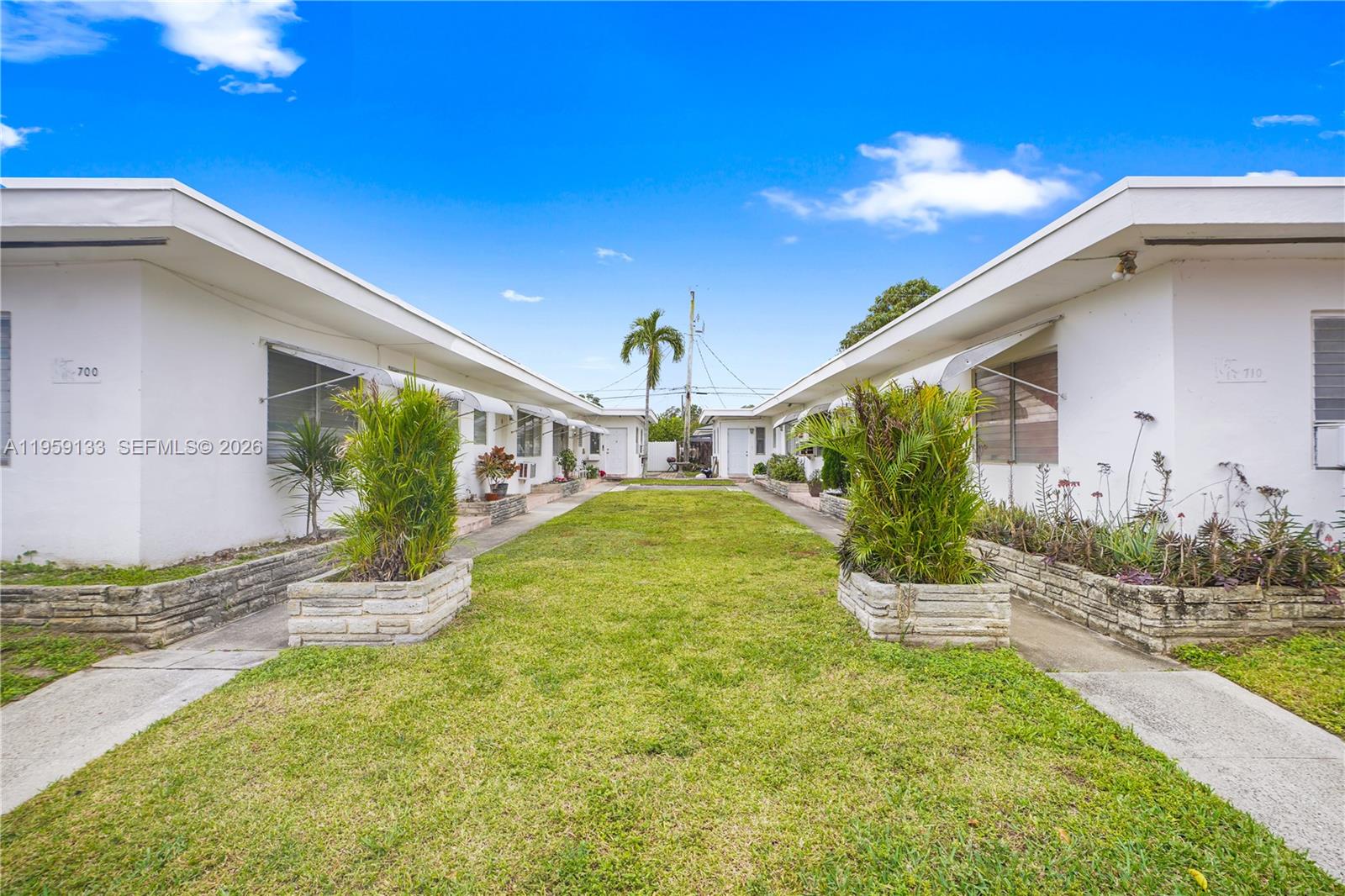 710 82nd Street, Unit 4 Miami Beach, FL 33141 - Photo 5 of 33 a view of an house with backyard and swimming pool