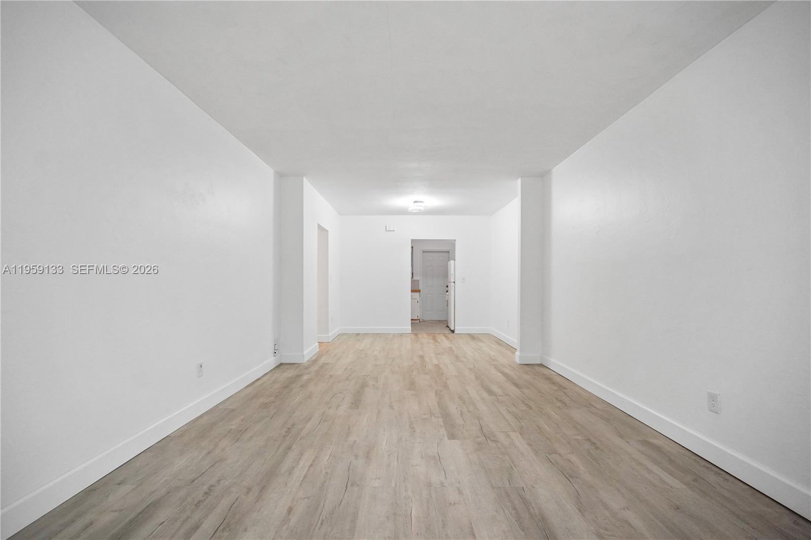 710 82nd Street, Unit 4 Miami Beach, FL 33141 - Photo 10 of 33 a view of empty room with wooden floor