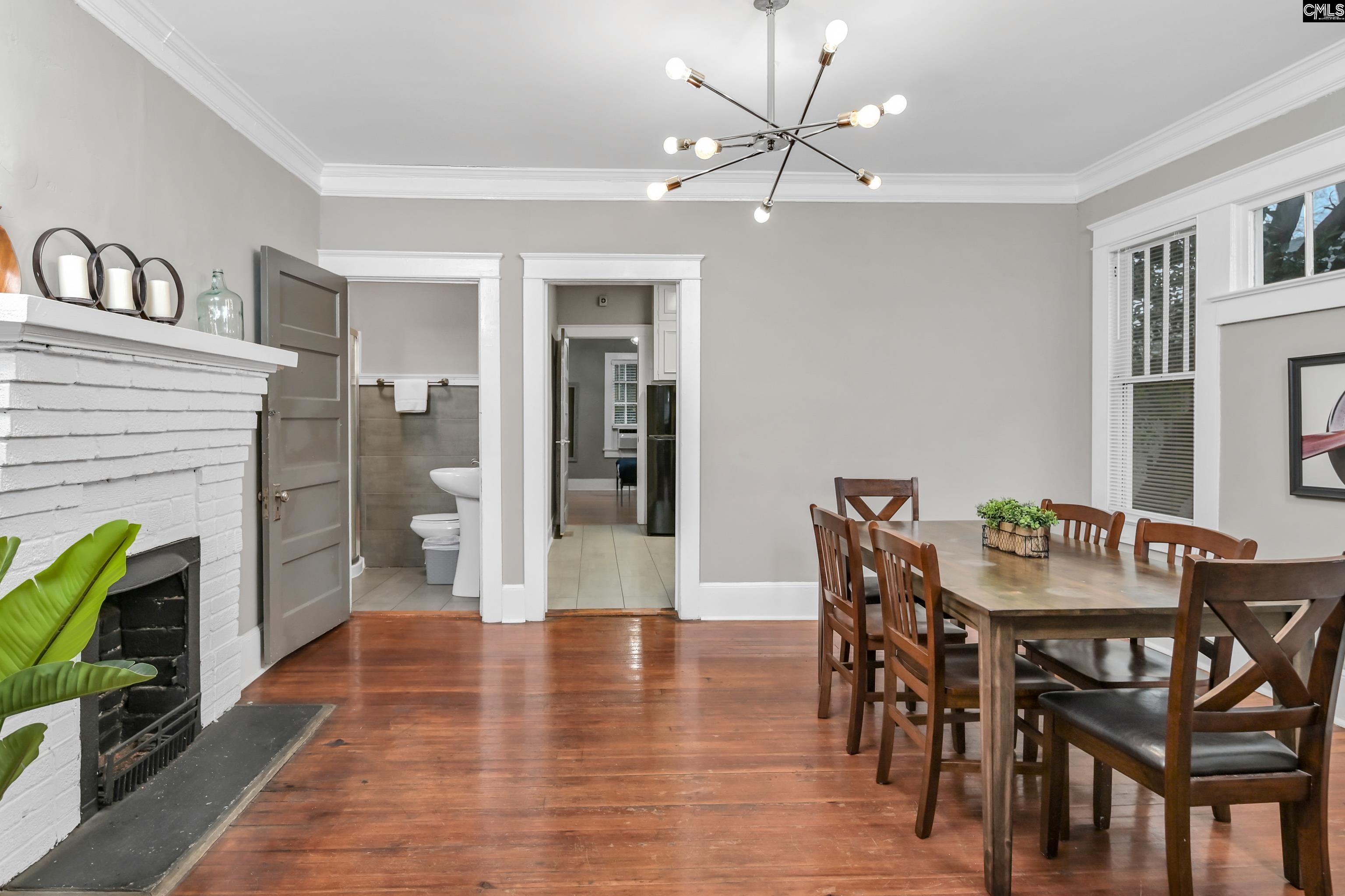 2227 Bull Street Columbia, SC 29201 - Photo 12 of 38 a view of a dining room with furniture and a fire place