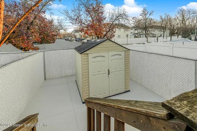 a view of a house with a snow in the yard