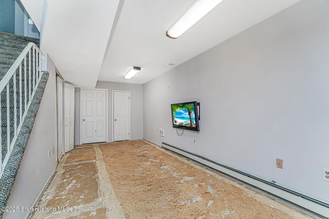 a view of a room with a flat screen tv