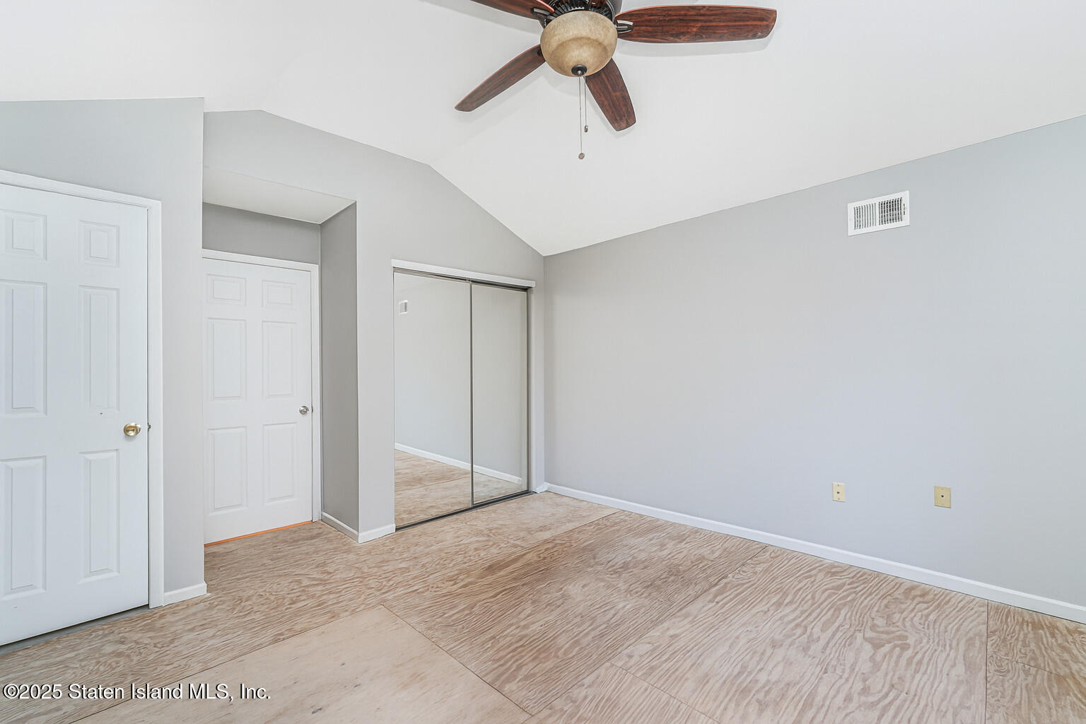 41 Crown Court Staten Island, NY 10312 - Photo 27 of 34 a view of a livingroom with a ceiling fan and entryway