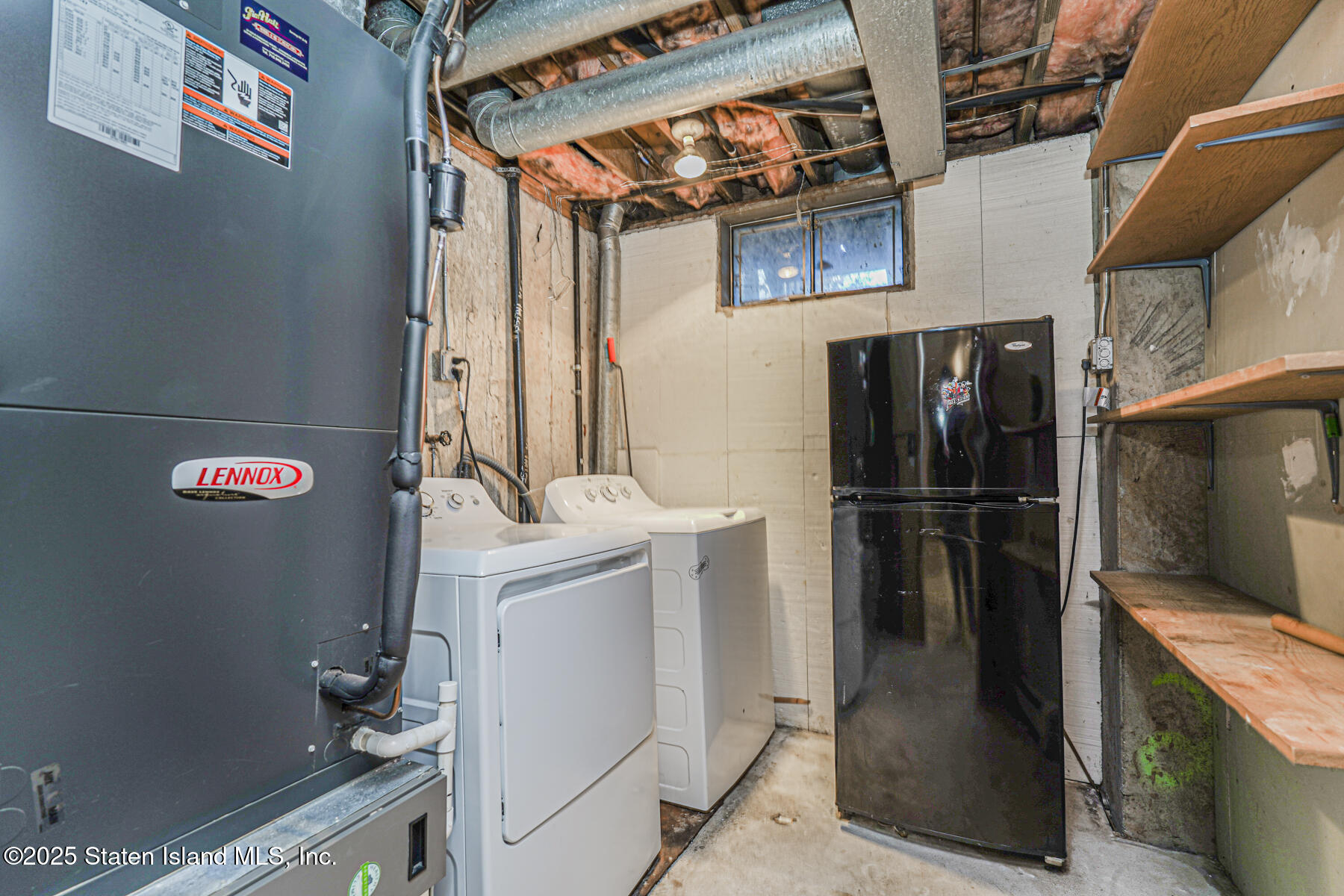 41 Crown Court Staten Island, NY 10312 - Photo 32 of 34 a utility room with dryer and washer