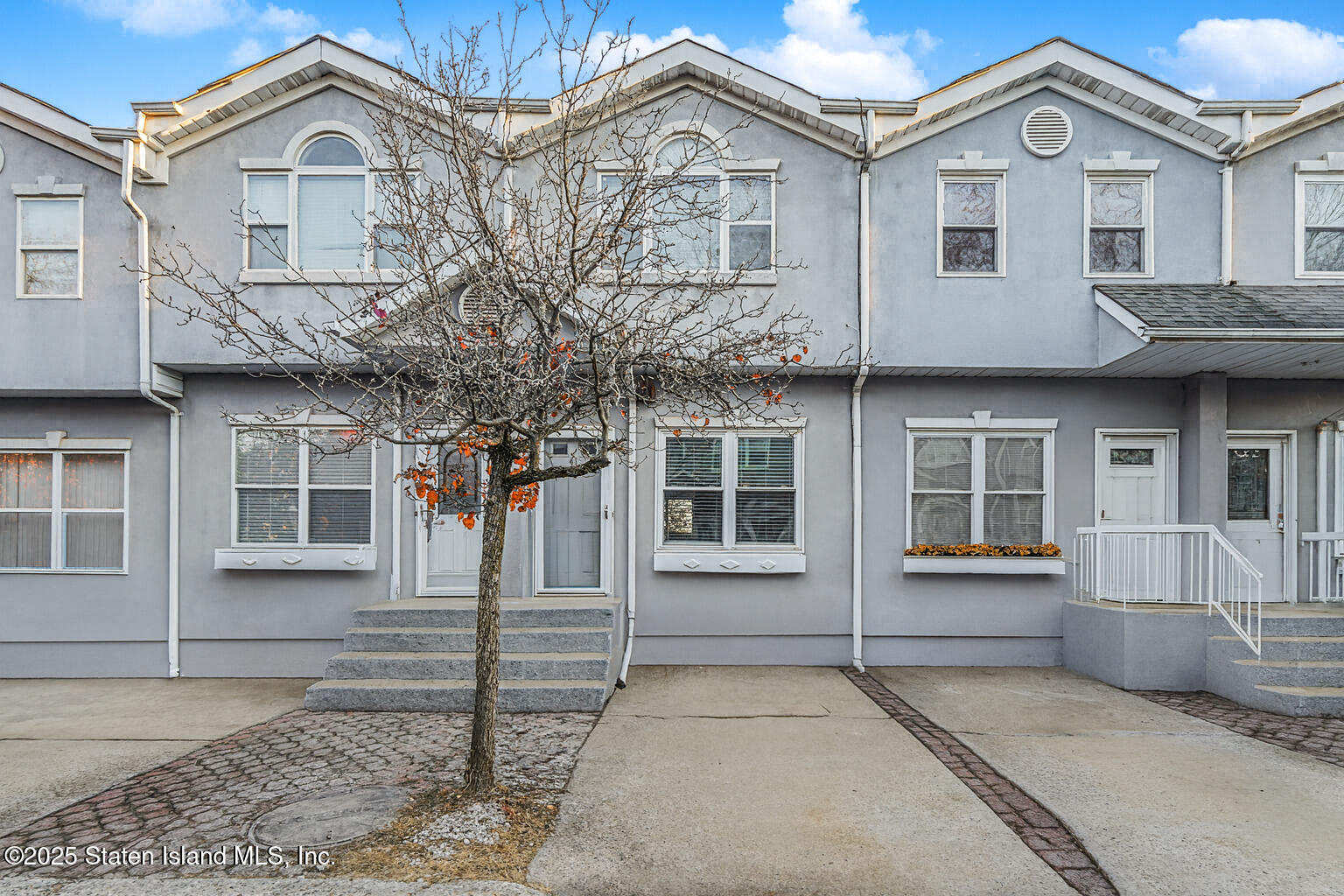 41 Crown Court Staten Island, NY 10312 - Photo 33 of 34 a front view of a house with a porch