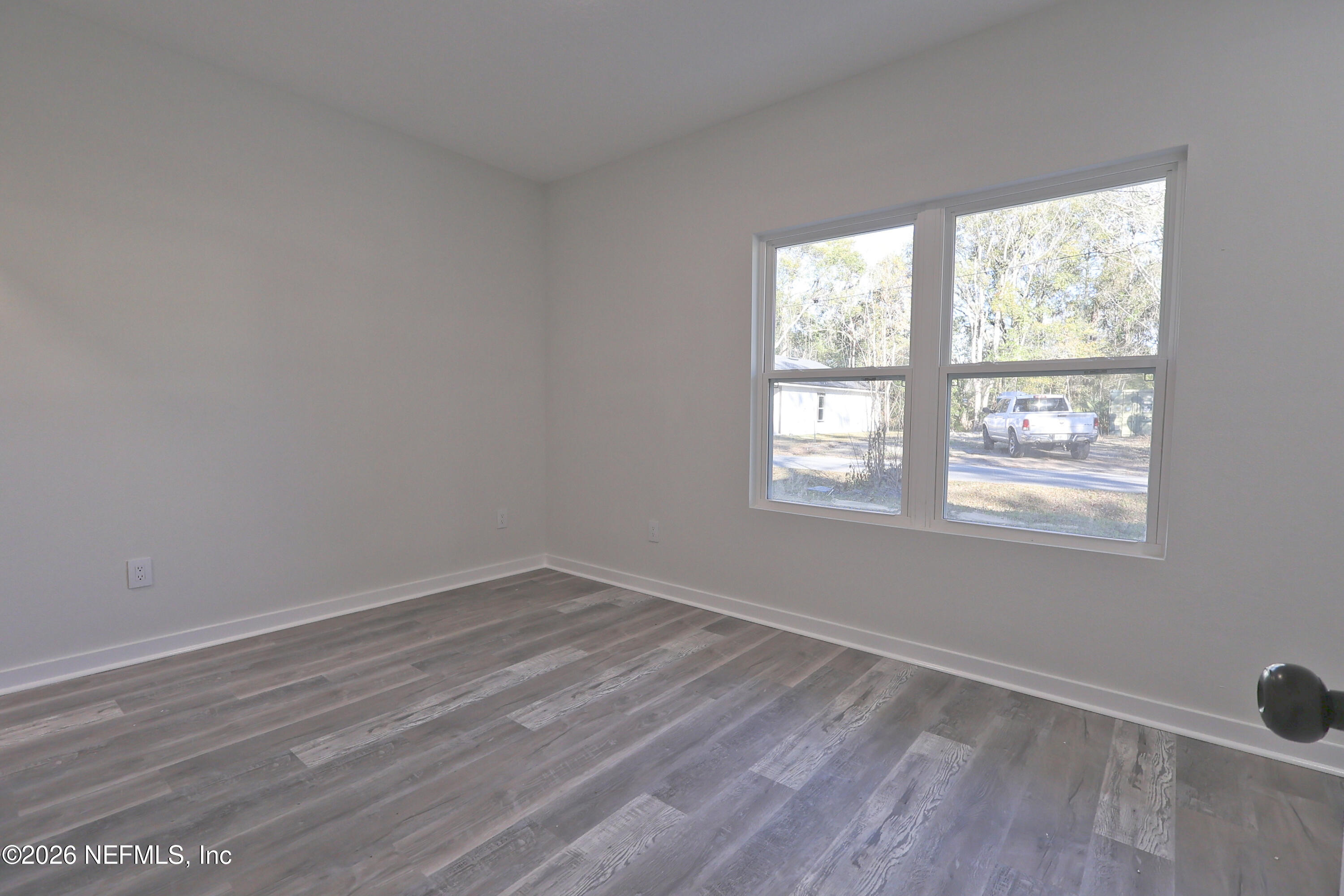 30 Delmonte Street Baldwin, FL 32234 - Photo 27 of 37 wooden floor in an empty room with a window