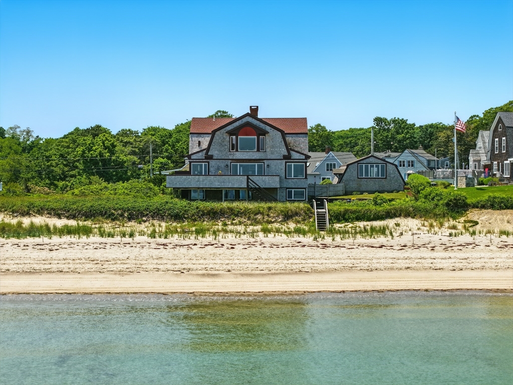 a view of a lake with a house in the background
