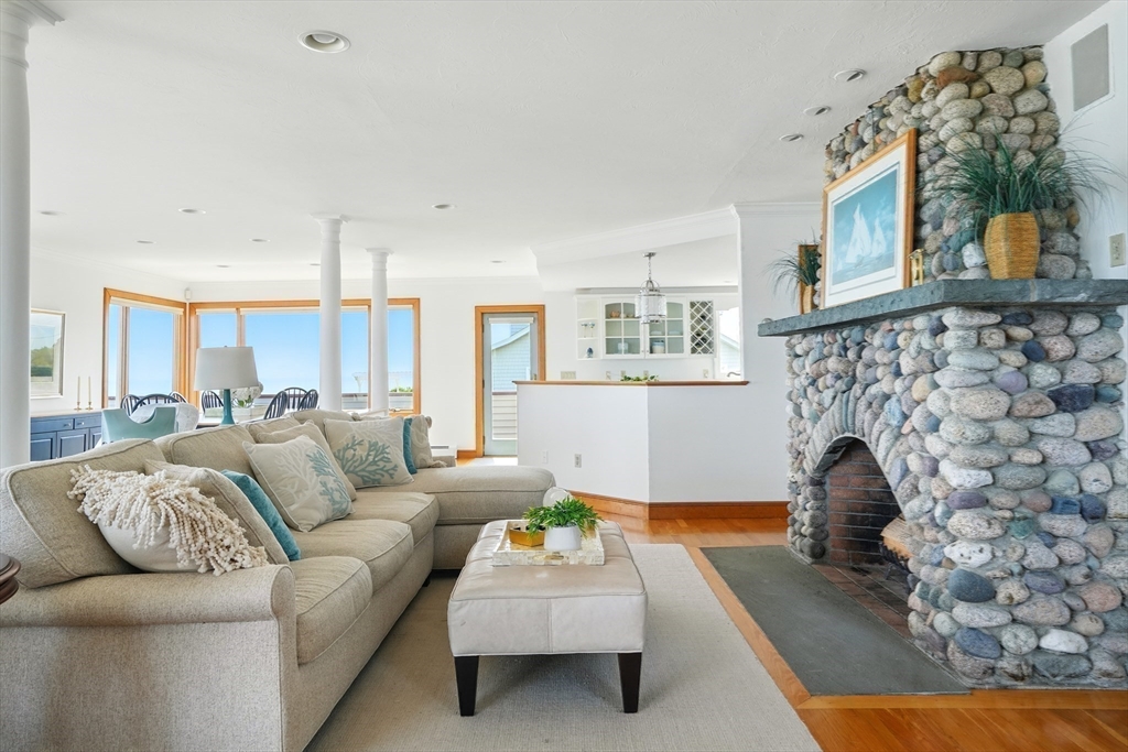 45 Phillips Road Bourne, MA 02562 - Photo 14 of 42 a living room with furniture and a fireplace