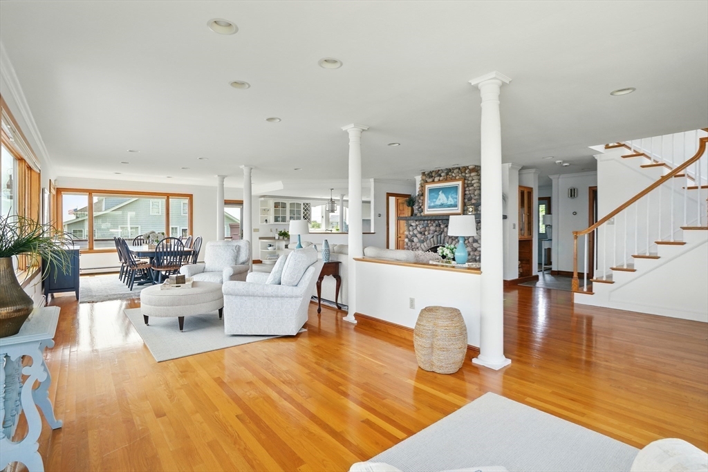 45 Phillips Road Bourne, MA 02562 - Photo 16 of 42 a living room with fireplace furniture and a wooden floor