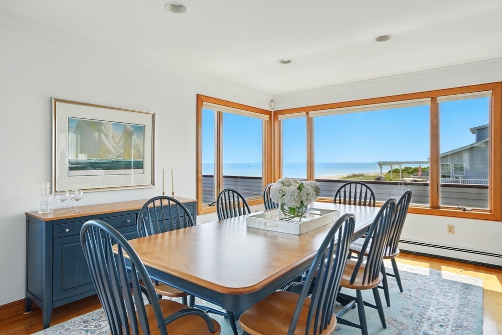 45 Phillips Road Bourne, MA 02562 - Photo 17 of 42 a view of a dining room with furniture window and wooden floor
