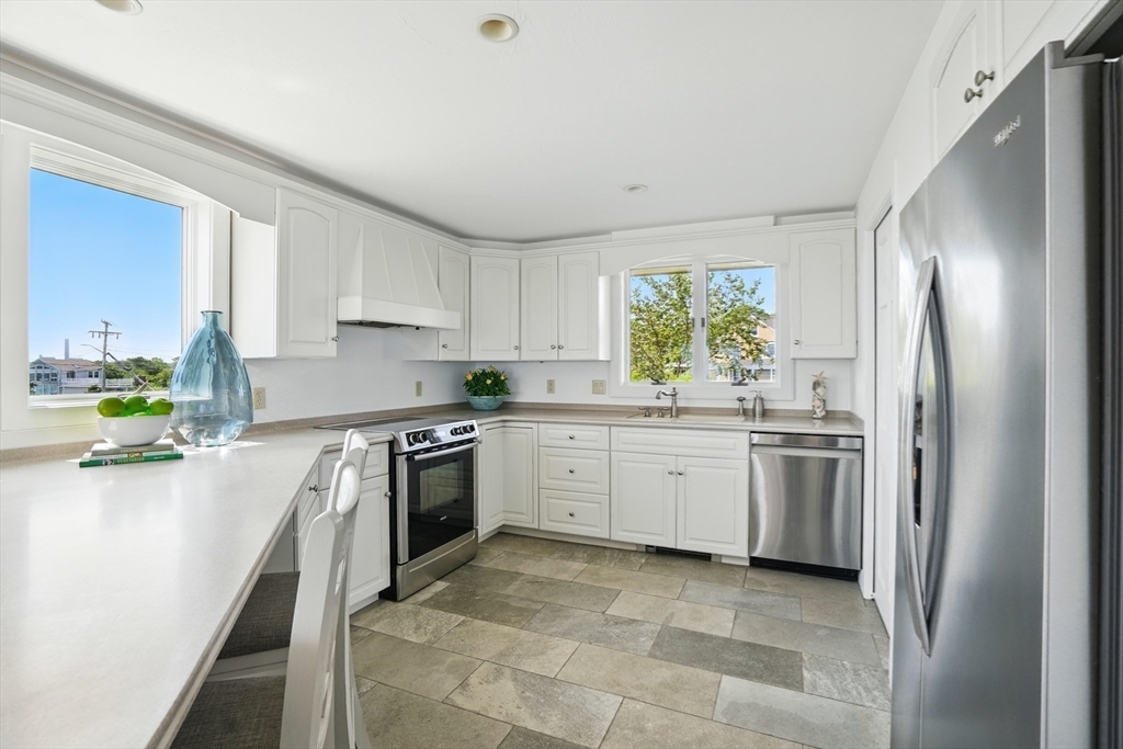 45 Phillips Road Bourne, MA 02562 - Photo 20 of 42 a kitchen with a refrigerator sink and stove