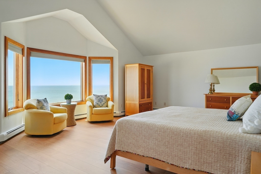 45 Phillips Road Bourne, MA 02562 - Photo 23 of 42 a bedroom with furniture and large windows