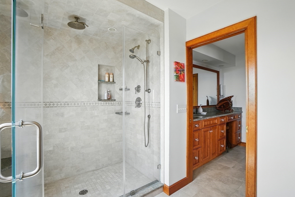 45 Phillips Road Bourne, MA 02562 - Photo 28 of 42 a en suite bathroom with a shower sink and mirror