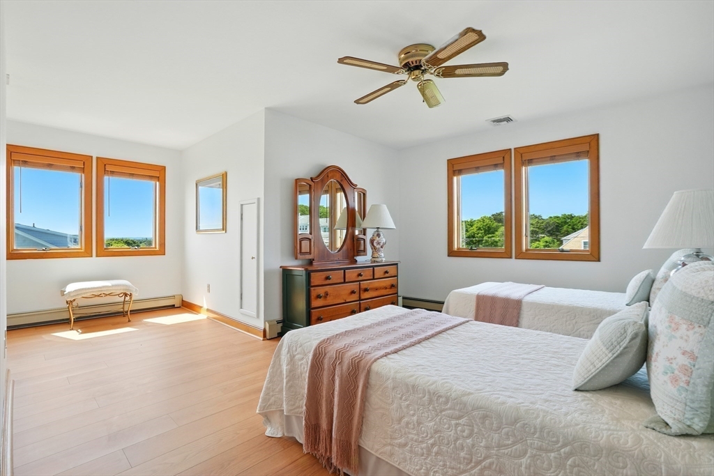 45 Phillips Road Bourne, MA 02562 - Photo 30 of 42 a bedroom with a large bed and a window