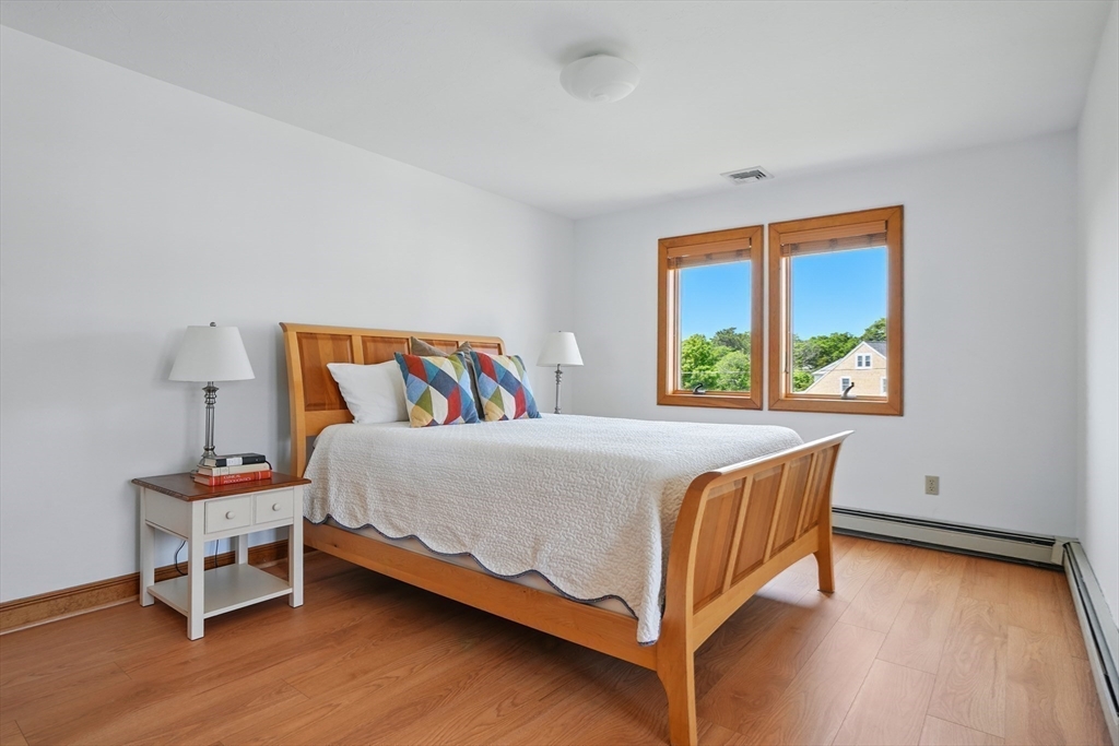 45 Phillips Road Bourne, MA 02562 - Photo 32 of 42 a bedroom with a bed and a window