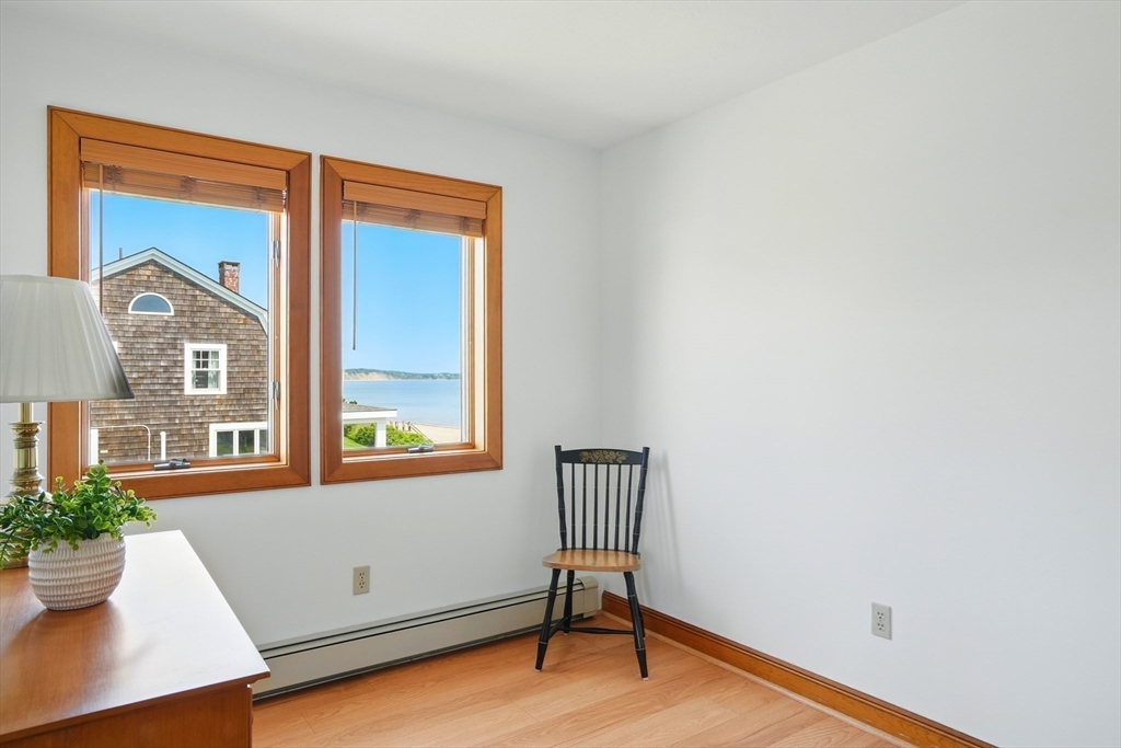 45 Phillips Road Bourne, MA 02562 - Photo 33 of 42 a view of an empty room with a window and wooden floor