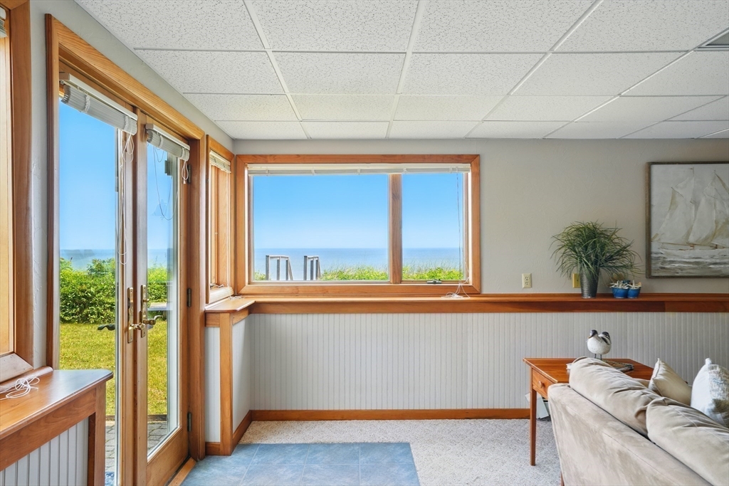 45 Phillips Road Bourne, MA 02562 - Photo 36 of 42 a view of a room with a large window and wooden floor