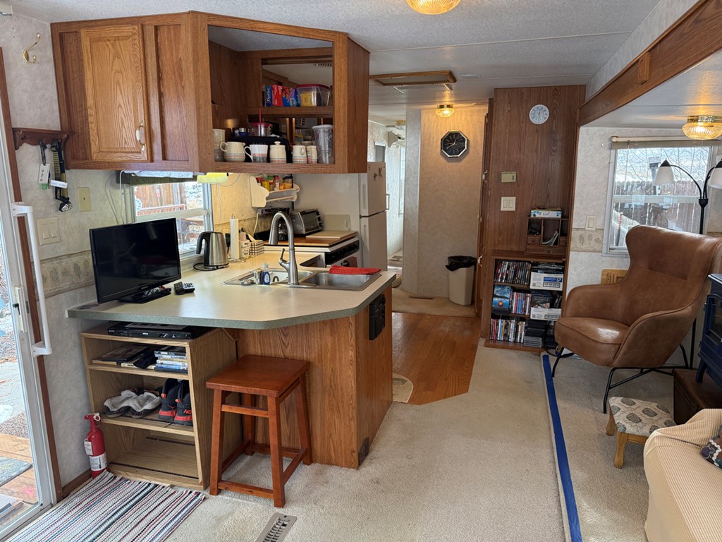 13 F Street Cascade, ID 83611 - Photo 8 of 26 Living Room & Kitchen Area