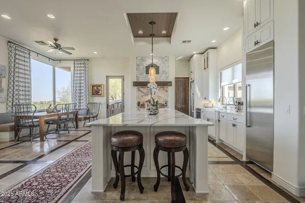 a spacious bedroom with a bed and a fireplace