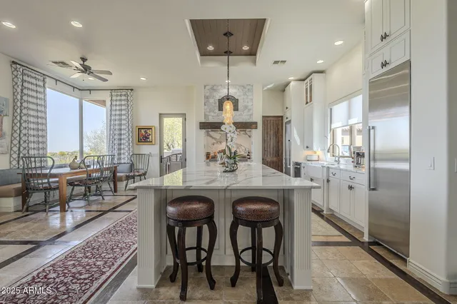 a spacious bedroom with a bed and a fireplace