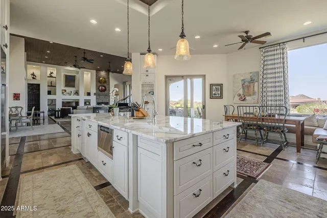 a spacious bedroom with a large bed and a flat screen tv