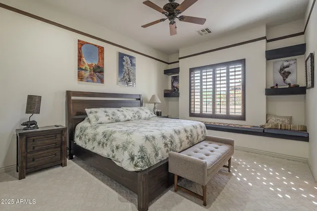a bathroom with a granite countertop toilet sink and a mirror
