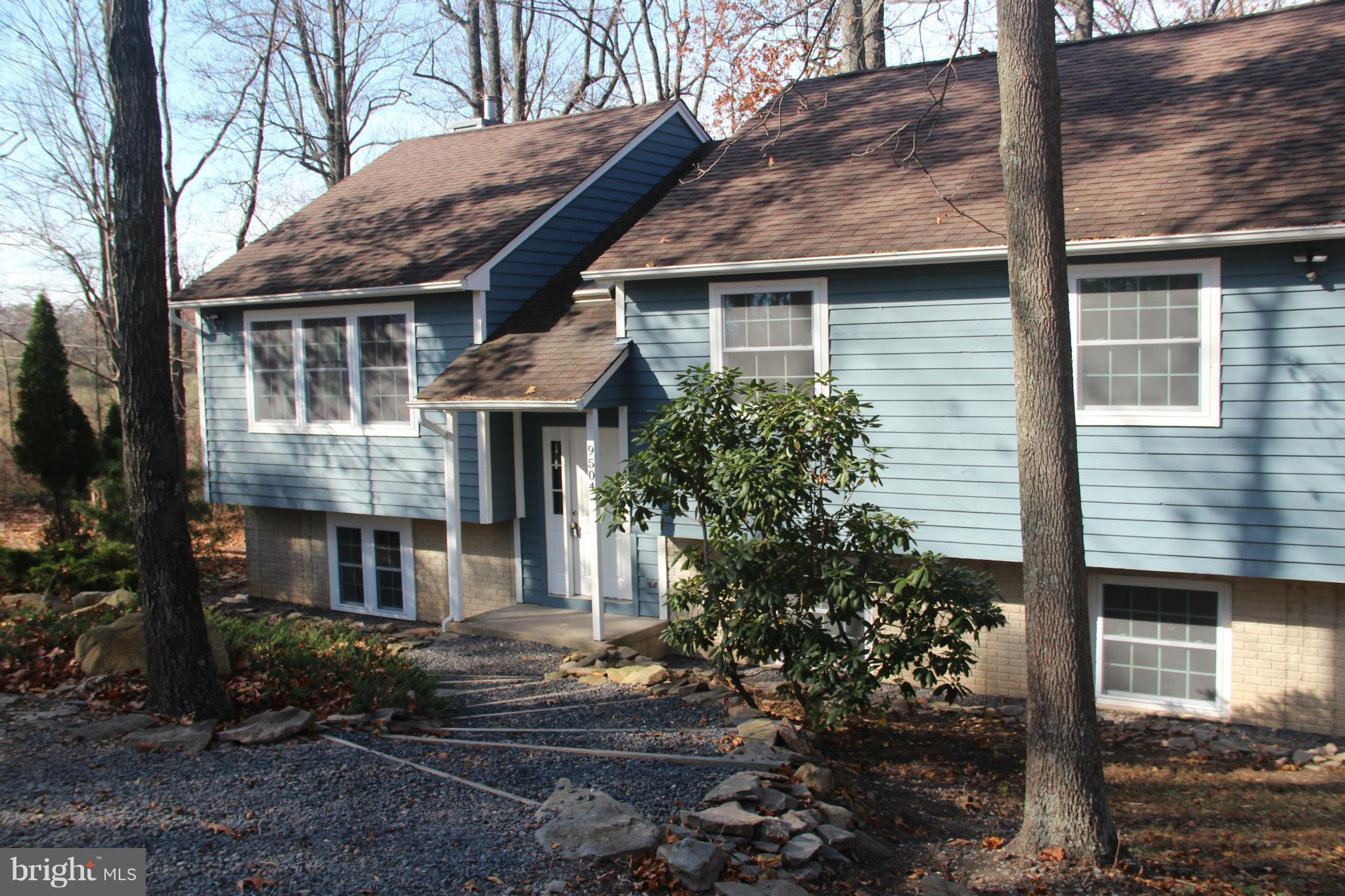 9504 Mountjoy Road Marshall, VA 20115 - Photo 3 of 27 a front view of a house with garden