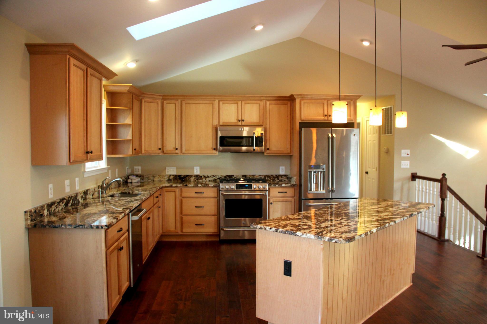 9504 Mountjoy Road Marshall, VA 20115 - Photo 6 of 27 a kitchen with stainless steel appliances granite countertop a stove a sink and a refrigerator