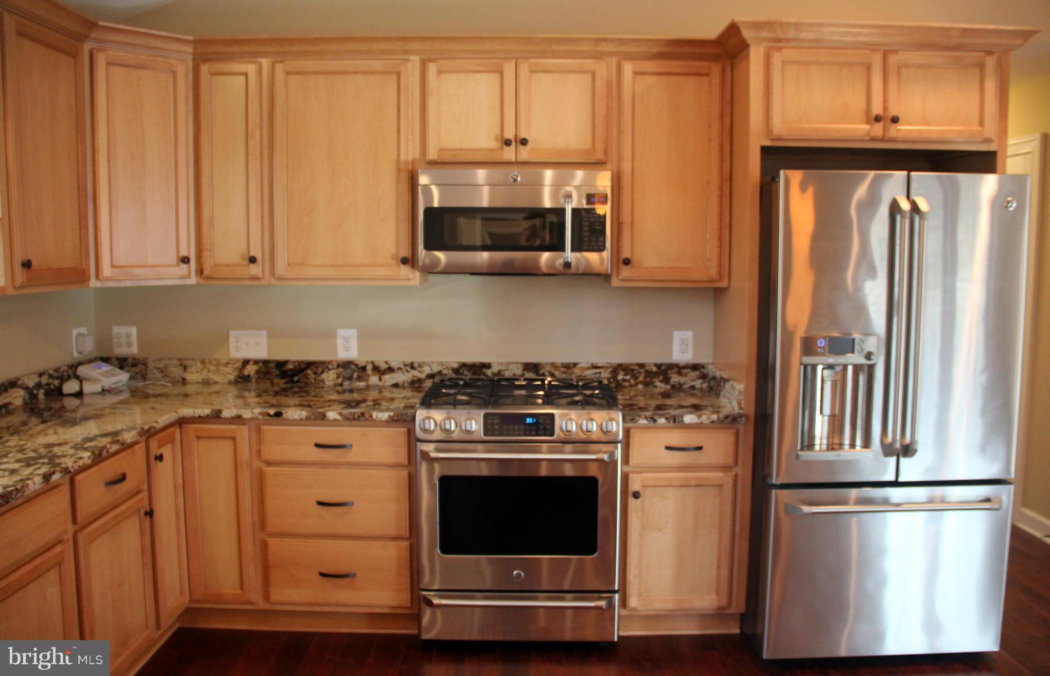 9504 Mountjoy Road Marshall, VA 20115 - Photo 7 of 27 a kitchen with stainless steel appliances granite countertop a stove a refrigerator and a microwave