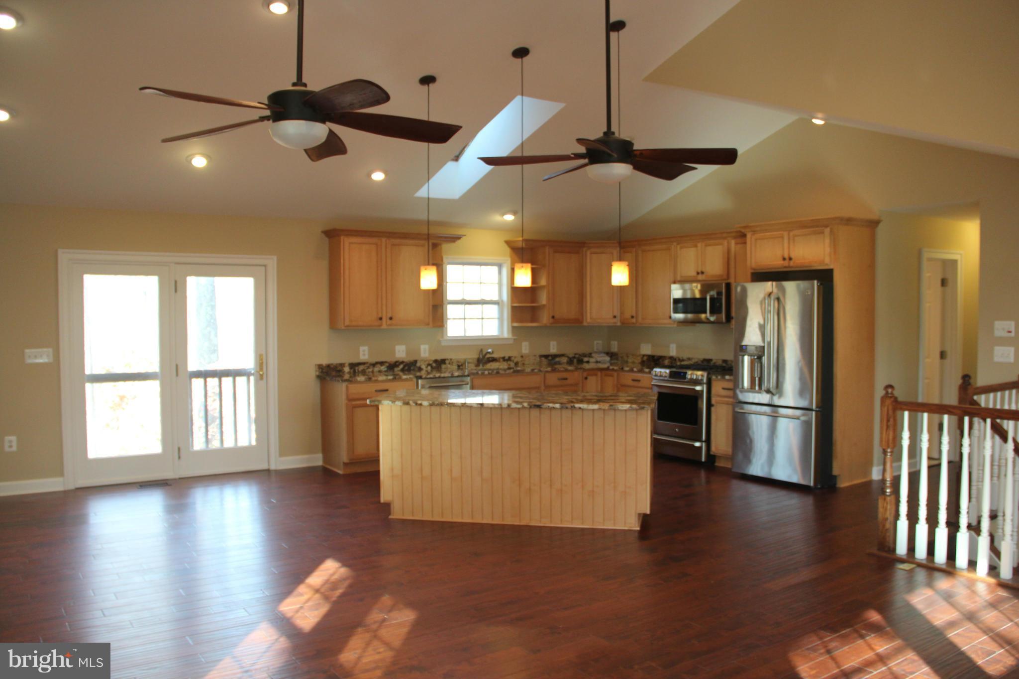 9504 Mountjoy Road Marshall, VA 20115 - Photo 10 of 27 a large kitchen with kitchen island a large island in it