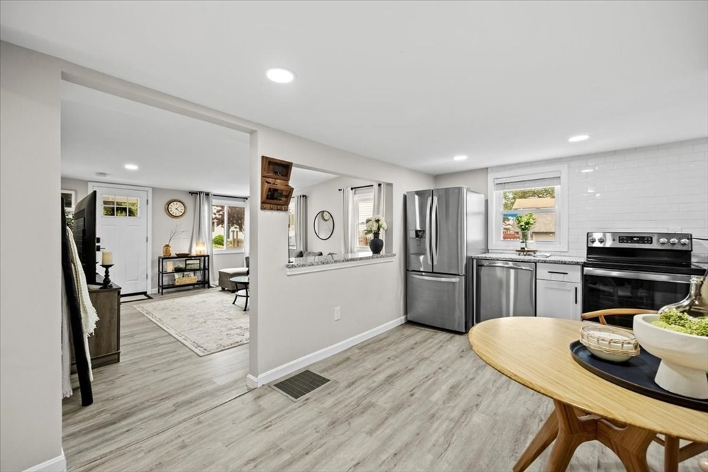 14 Pinehurst Drive Wareham, MA 02571 - Photo 12 of 41 a kitchen with a refrigerator and a stove top oven